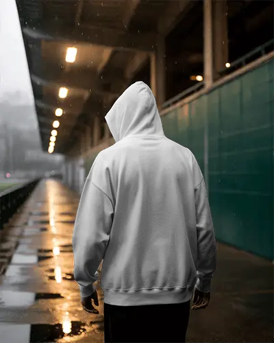 Rainy Evening Hoodie Mockup Male Model Facing Away Under Covered Walkway Reflective Wet Surface 0788