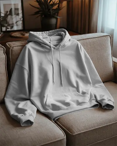 Cozy Living Room Hoodie Mockup White Sweatshirt Resting On Sofa With Soft Morning Light 0792