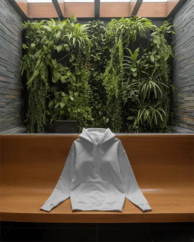 Natural Light Hoodie Mockup On Bench Below Vertical Garden Wall In Modern Indoor Setting 0796