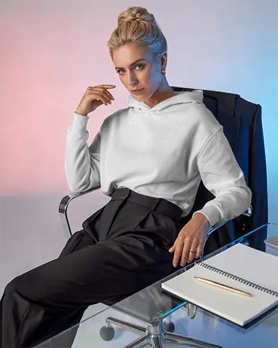 Executive Style Hoodie Mockup Female Model In Modern Office Chair With Notebook On Glass Table 0797