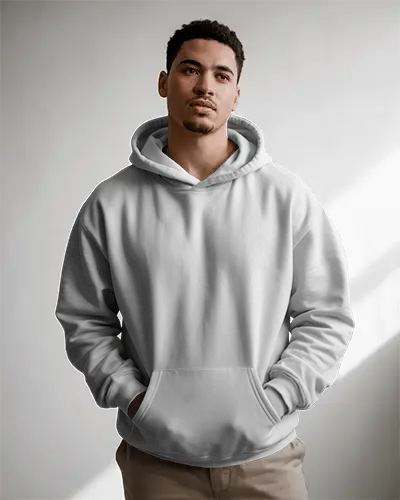 Natural Light Hoodie Mockup Male Model Standing In Soft Shadowed Studio With Hands In Pockets 0799