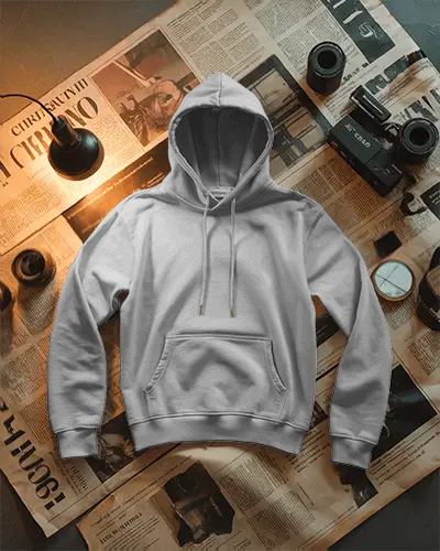 Flat Lay Hoodie Mockup On Retro Newspaper Background With Vintage Camera And Table Lamp Setup