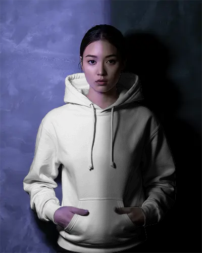 Cinematic Light Hoodie Mockup Model Standing Still Against Blended Textured Interior Wall