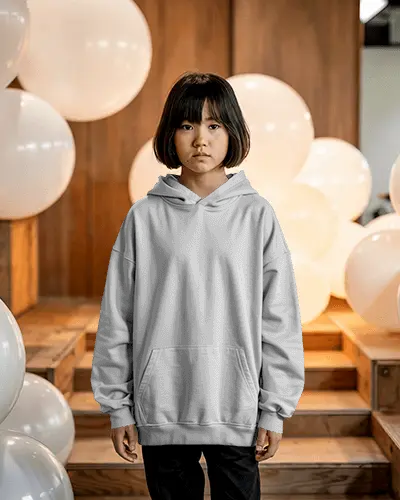 indoor-balloon-decor-hoodie-mockup-kid-girl-model-standing-in-soft-lit-wooden-stair-space