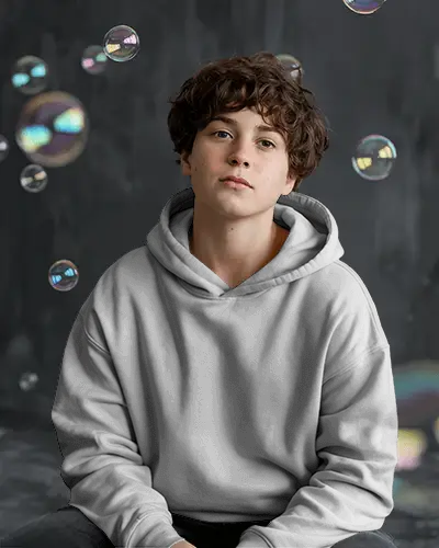 Dreamy Bubble Hoodie Mockup Kid Seated With Floating Soap Bubbles