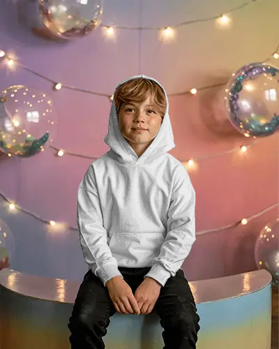 Cozy Kids Hoodie Mockup With Hood Up Sitting On Stool In Festive Studio Background