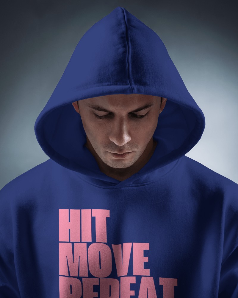 Focused Hoodie Mockup Front View Male Model Looking Down Soft Lighting For Calm And Reflective Atmosphere