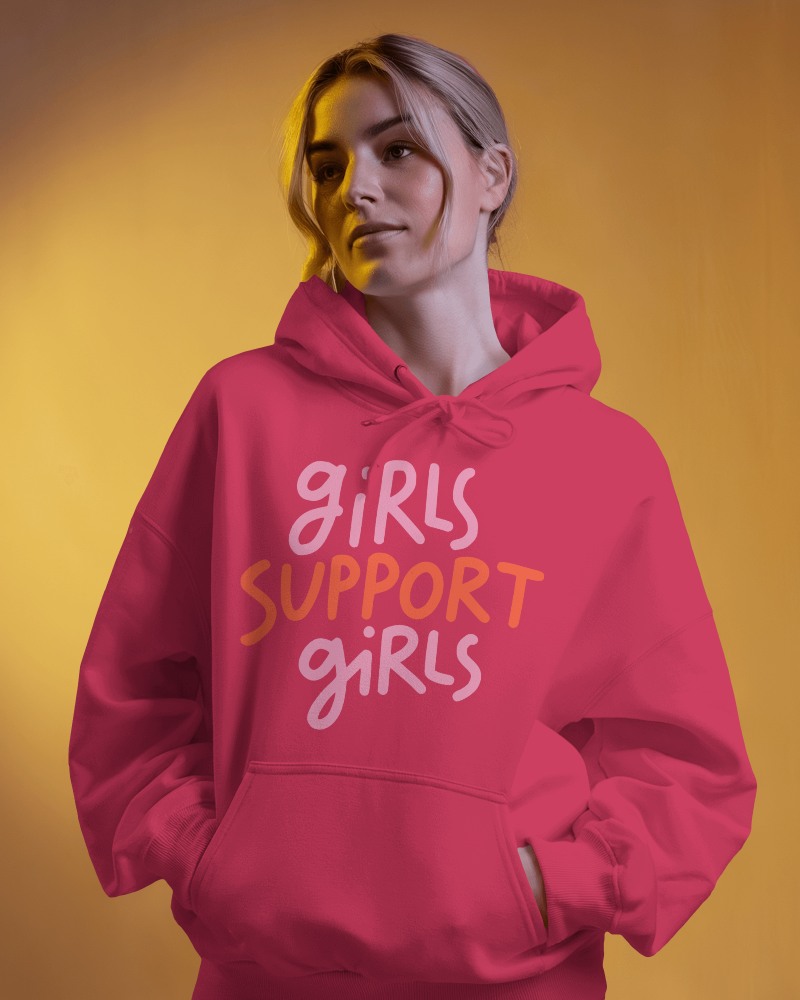 Hoodie Mockup On Female Model With Orange Backdrop Bold And Fashion Forward Look
