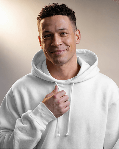 Hoodie Mockup Male Model Smiling In Soft Warm Lighting Approachable And Relaxed Style