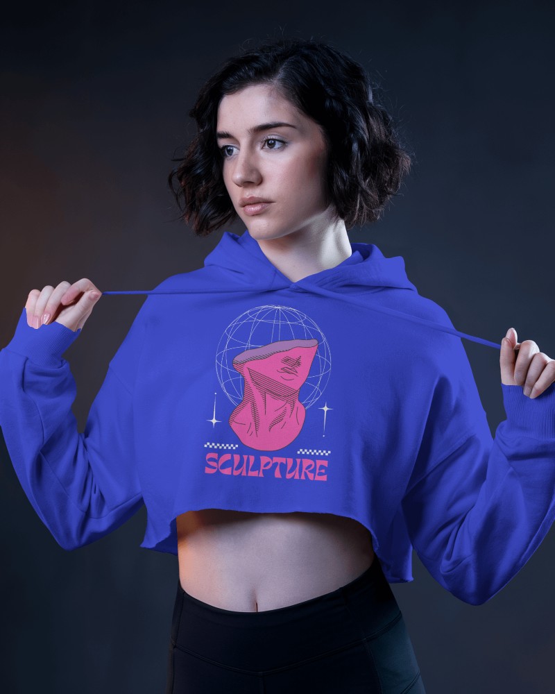 Cropped Hoodie Mockup Female Model Holding Strings In Dramatic Lighting Modern And Bold Look
