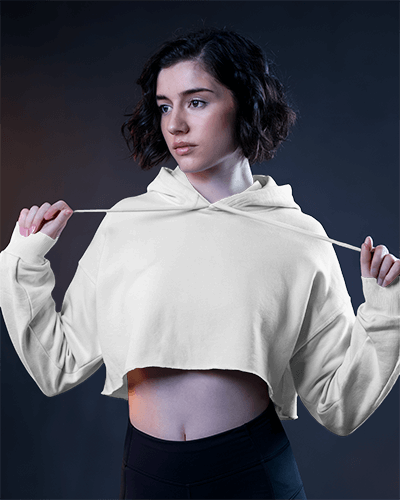 Cropped Hoodie Mockup Female Model Holding Strings In Dramatic Lighting Modern And Bold Look