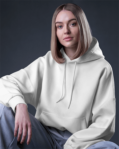 Relaxed Pose Hoodie Mockup Female Model With Long Hair In Studio Setting With Moody Lighting