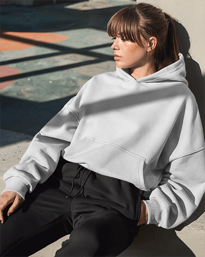 Outdoor Streetwear Hoodie Mockup Female Model In Casual Pose Under Natural Sunlight