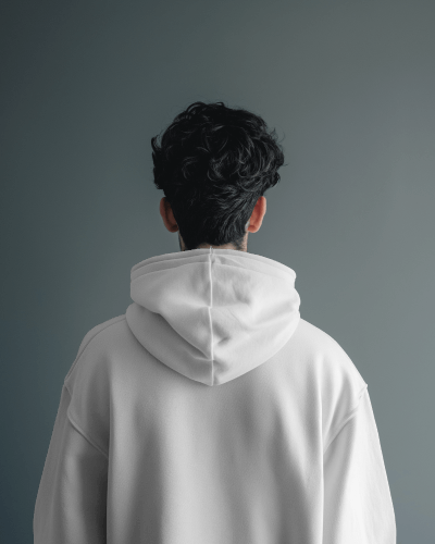 Back View Of Man Wearing Hoodie Mockup In Grey Studio