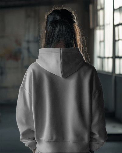 Close Up Hoodie Mockup On Female Model With Curly Hair In Minimal Lighting