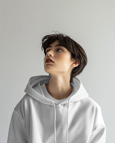 Female Model Wearing Hoodie Mockup With Neutral Expression On Plain Background