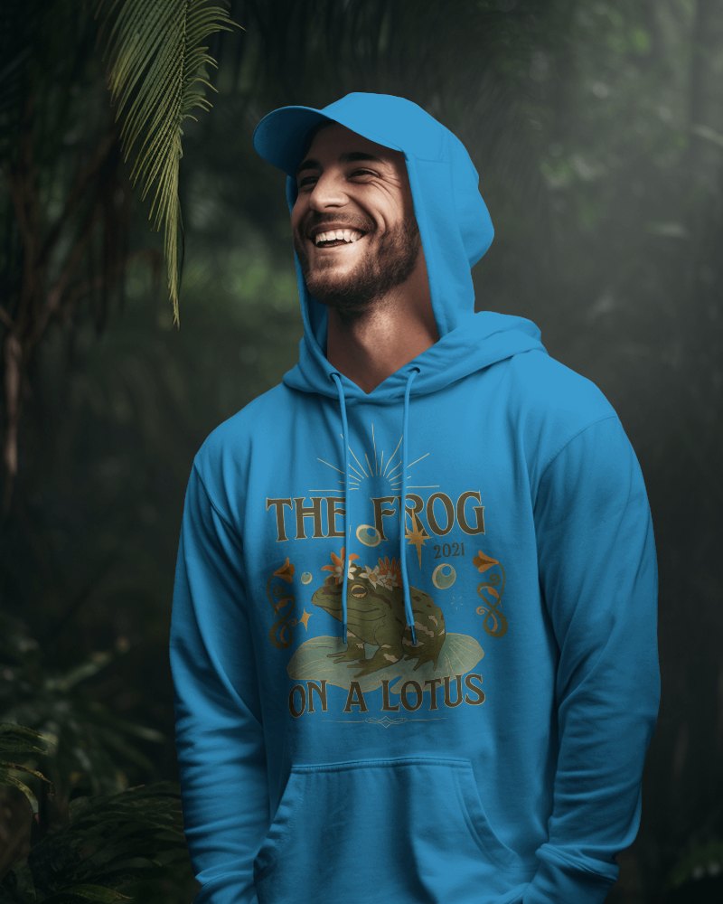 Male Model Smiling In Hoodie Mockup With Tropical Forest Surrounding