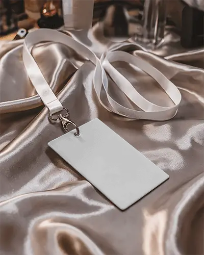 Fashion Forward Name Tag Mockup On Reflective Luxury Fabric And Premium White Strap