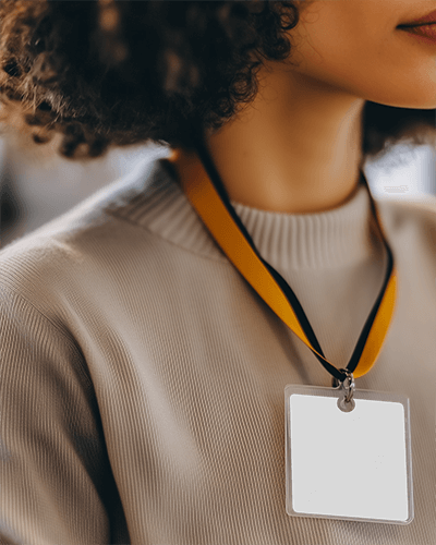 Relaxed Outdoor Id Card Mockup Female Model Seated With Lanyard Soft Breeze And Sunlight  Nature 090