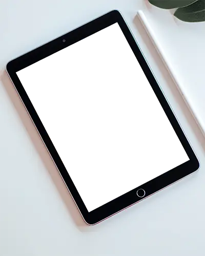 Minimal Top View Ipad Mockup On White Desk With Apple Pencil And Green Leaves Clean And Modern Setup