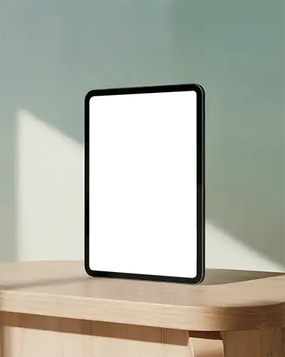 Standing Ipad Mockup On Light Wood Table With Soft Shadow Play And Pastel Wall Modern And Artistic Display Scene