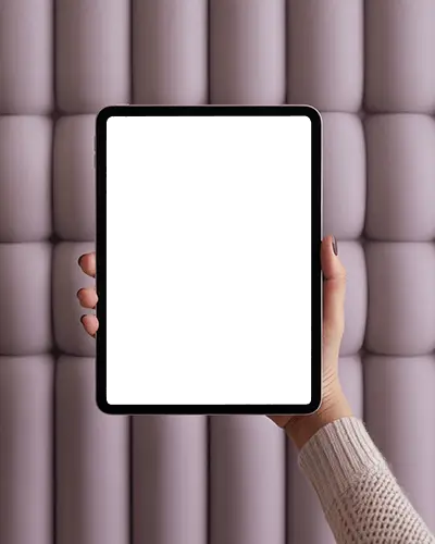 Hand Held Ipad Air Mockup With Soft Focus A Pastel Pink Tufted Wall Background