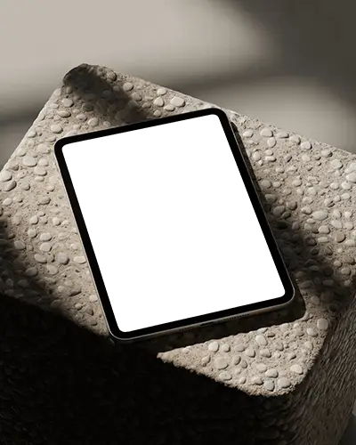 Ipad Pro Mockup Top View On Pebble Textured Stone Block In Soft Daylight