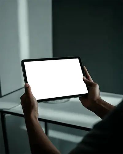 Moody Ipad Mini Mockup Hands Holding Tablet In Dark Toned Environment With Subtle Light