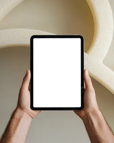 Ipad Mini Mockup Handheld Upright In Front Of Abstract Foam Structure In Modern Studio Light
