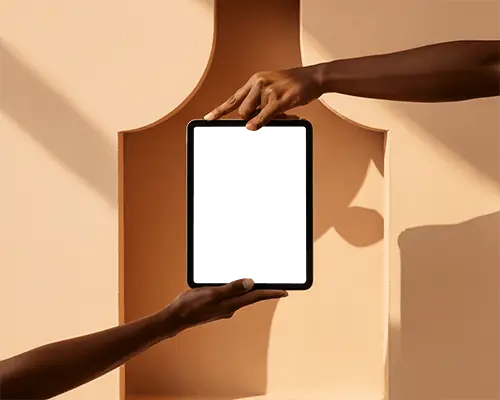 Sunlit Ipad Mini Mockup Framed By Hands In Symmetric Cutout Wall Architecture