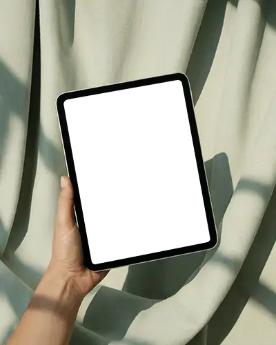 Sunlit Curtain Background Ipad Mini Mockup Handheld In Bright Soft Draped Setting