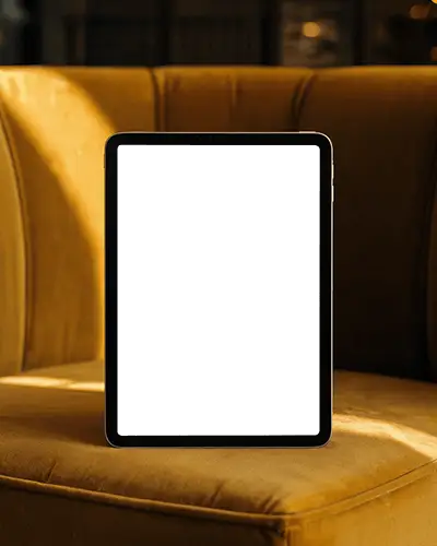 Cozy Armchair Ipad Mini Mockup With Warm Golden Hour Lighting In Vintage Setting