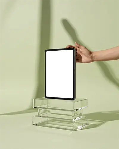 Ipad Air Mockup Held By Hand On Clear Acrylic Stand With Minimal Green Studio Background