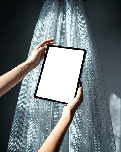 hands-holding-ipad-air-mockup-under-spotlight-against-metallic-ribbon-curtain