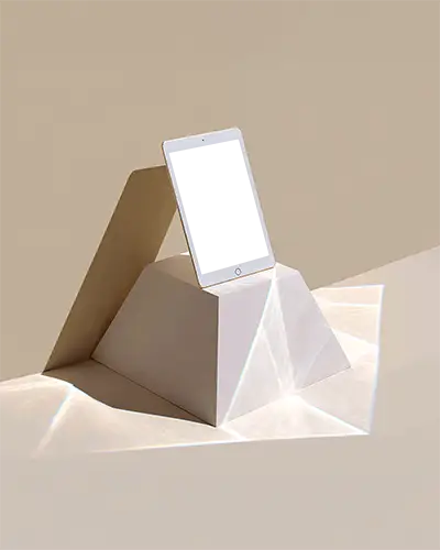 ipad-air-mockup-standing-on-geometric-pyramid-pedestal-in-studio-light-with-modern-artistic-style