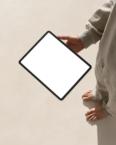 Ipad Pro Mockup Handheld Sideways In Minimal Studio Scene With Barefoot Model