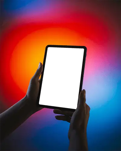 Ipad Mini Mockup Held In Hands Against Vivid Red Blue Gradient Background