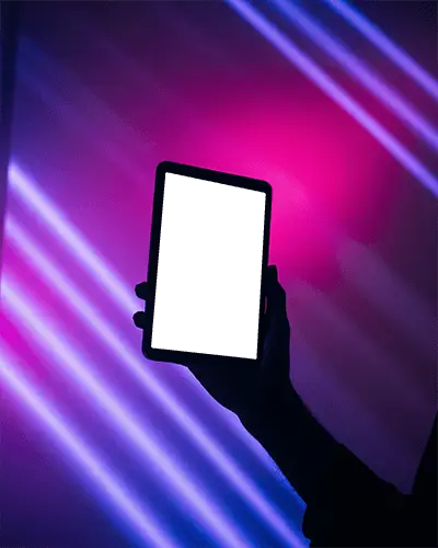 Editable Ipad Mini Mockup Hand Holding Device Against Modern Neon Lighting Studio Glow