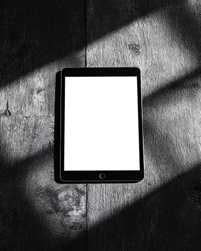 Sleek Ipad Air Mockup On Textured Wooden Background With Contrasting Light For Presentation