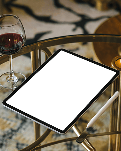 Luxury Ipad Mockup Digital Tablet On Elegant Glass Table With Wine Glass And Stylus Showcasing Surreal Floating Tree Artwork Cosmic Dreamlike Aesthetic