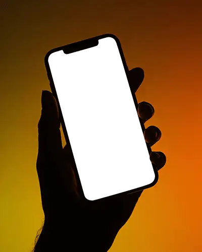 Hand Holding Iphone 12 Mockup With Dark Screen Against Gradient Background