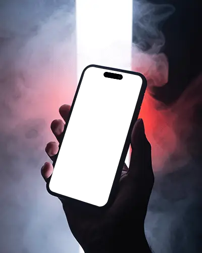 Iphone 15 Plus Mockup Handheld In Smoky Scene With Glowing Backlight And Red Side Glow
