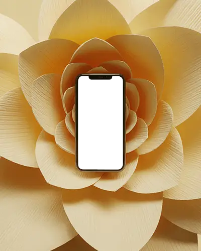 floral-iphone-12-mockup-in-large-yellow-paper-flower-petal-backdrop