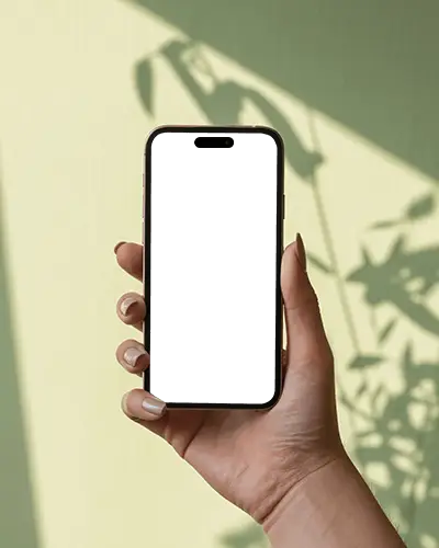 iphone-16-pro-mockup-handheld-with-botanical-shadows-on-soft-green-wall