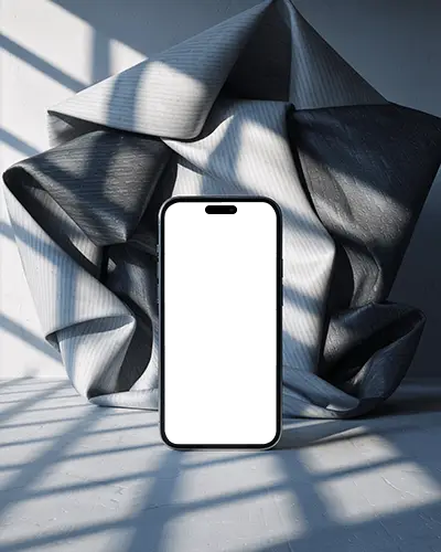 modern-iphone-15-plus-mockup-smartphone-in-studio-scene-with-crumpled-fabric-and-dramatic-shadows