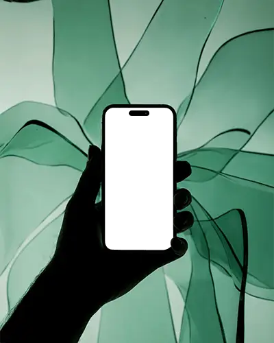 futuristic-iphone-16-pro-mockup-hand-holding-smartphone-against-flowing-green-fabric-light-scene