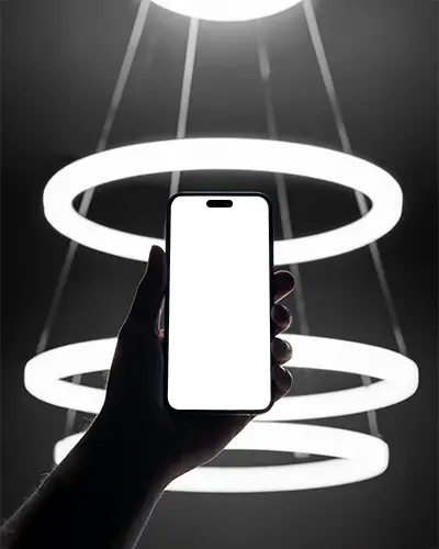 futuristic-iphone-15-plus-mockup-hand-holding-smartphone-against-glowing-ring-lights-in-dark-setting
