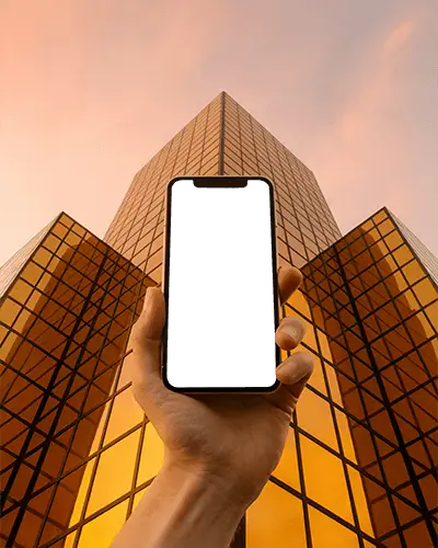 Iphone 12 Mockup Handheld Smartphone Against Golden Skyscraper Reflection At Sunset Skyline