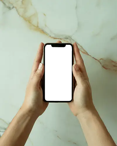 Iphone 13 Mockup Hands Holding Smartphone Above Luxury Marble Surface Minimal Modern Aesthetic