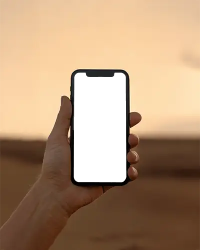 Iphone 12 Mockup Elegant Handheld Device Captured In Front Of Desert Sunset Golden Horizon